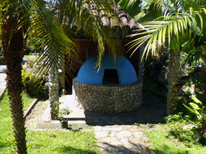 A ncely rustic wood-fired oven occupies a spot behind the reception building and in front of the restaurant.